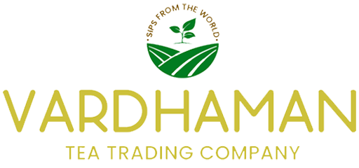 Vardhaman Tea Trading Company logo. It features the 'Sips From The World' circular emblem at the top, followed by the word 'VARDHAMAN' in large gold letters and 'TEA TRADING COMPANY' in smaller gold letters below.